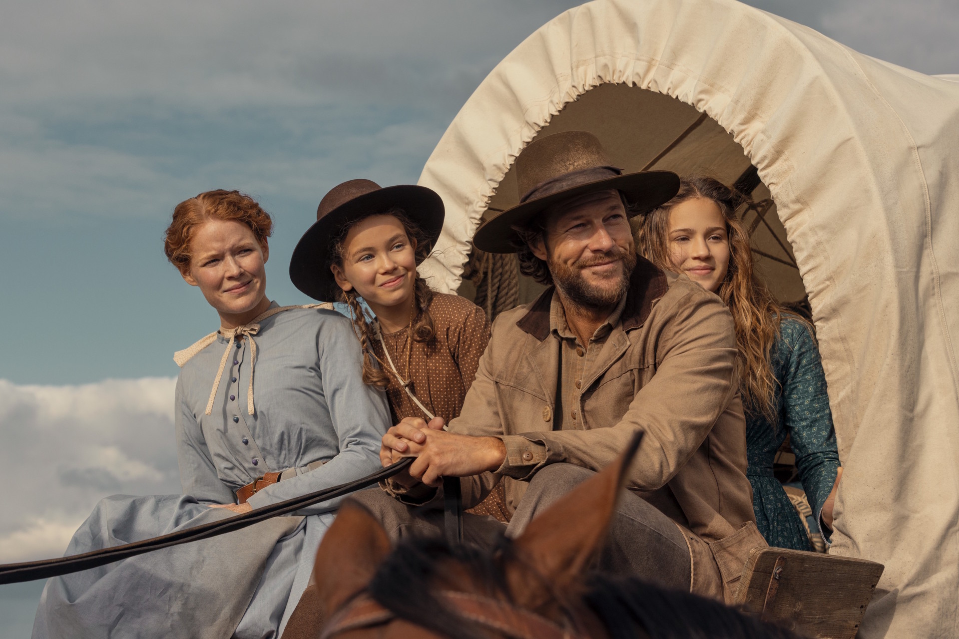 Laura Ingalls Wilder and family in a wagon on the new Netflix show