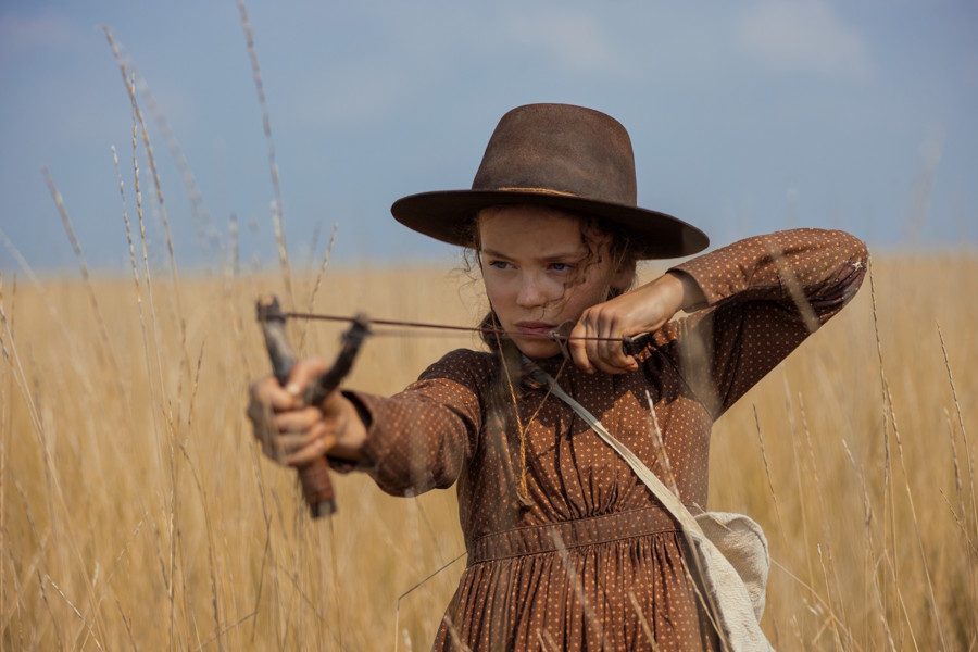 Laura with a slingshot on the new Little House on the Prairie Netflix show
