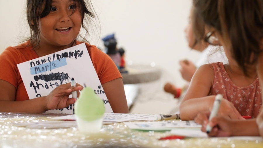 Girls help each other learn at Akin family services