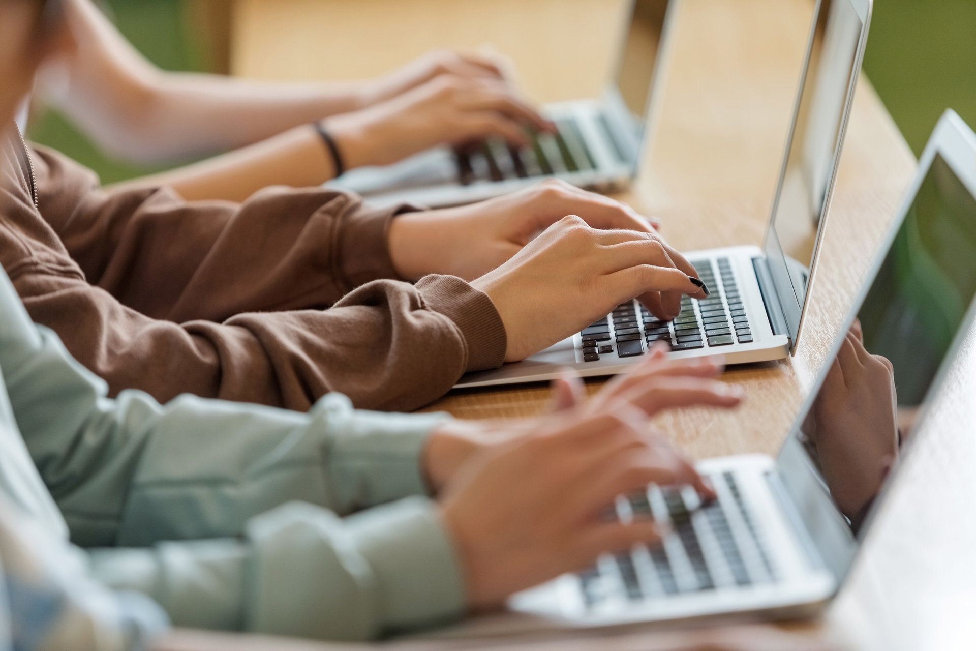 kids working on school computer laptops