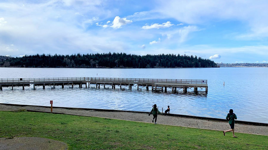 kids running toward the water at scenic Groveland Beach.