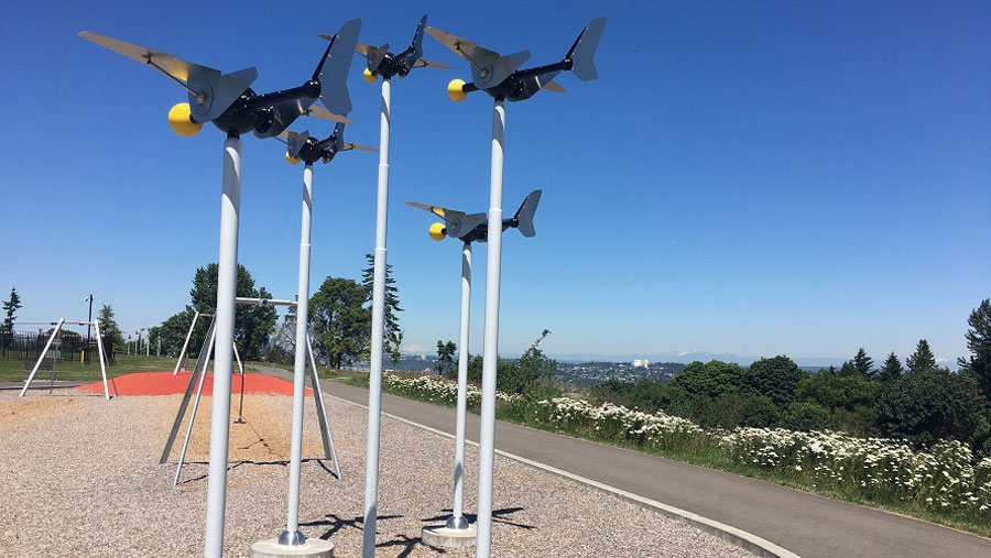 Airplane sculpture and zip lines at Westcrest Park with views of Mount Baker in the distance.