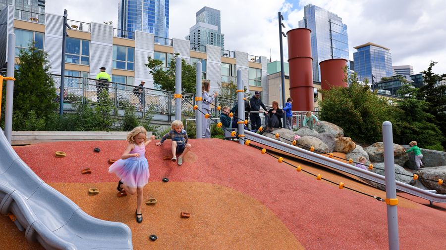 kids running down the hill at Overlook Walk playground