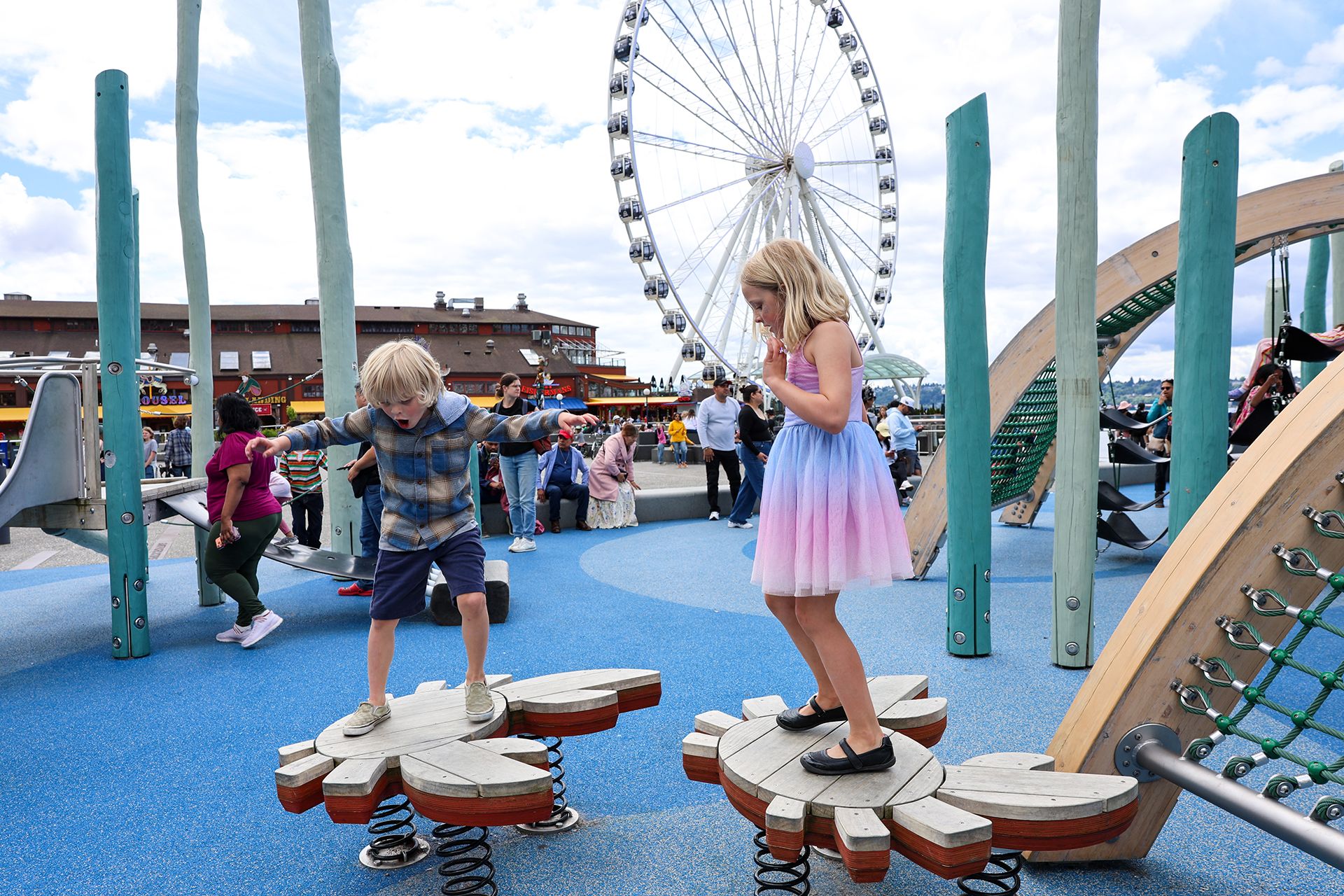 kids playing on the Seattle Waterfront Pier 58 playground, a top Seattle attraction