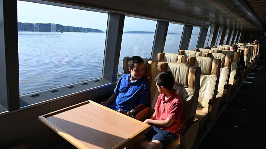 The upper deck of the FRS Clipper with leather seats and water views
