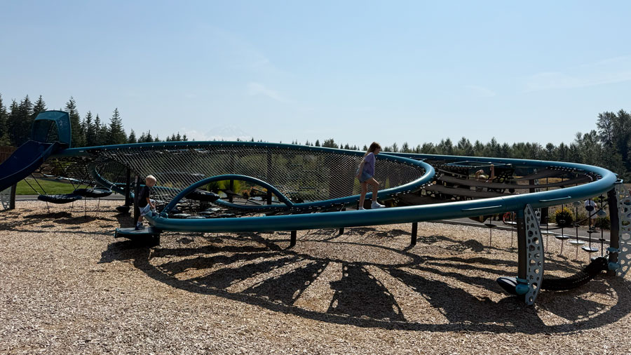 kids walking the spiral structure at Tehaleh's Infinity Park