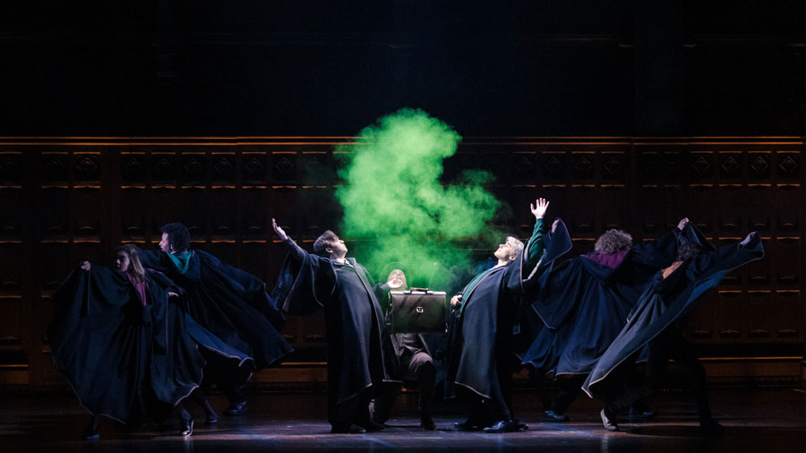 Green smoke billowing above the cast during the production
