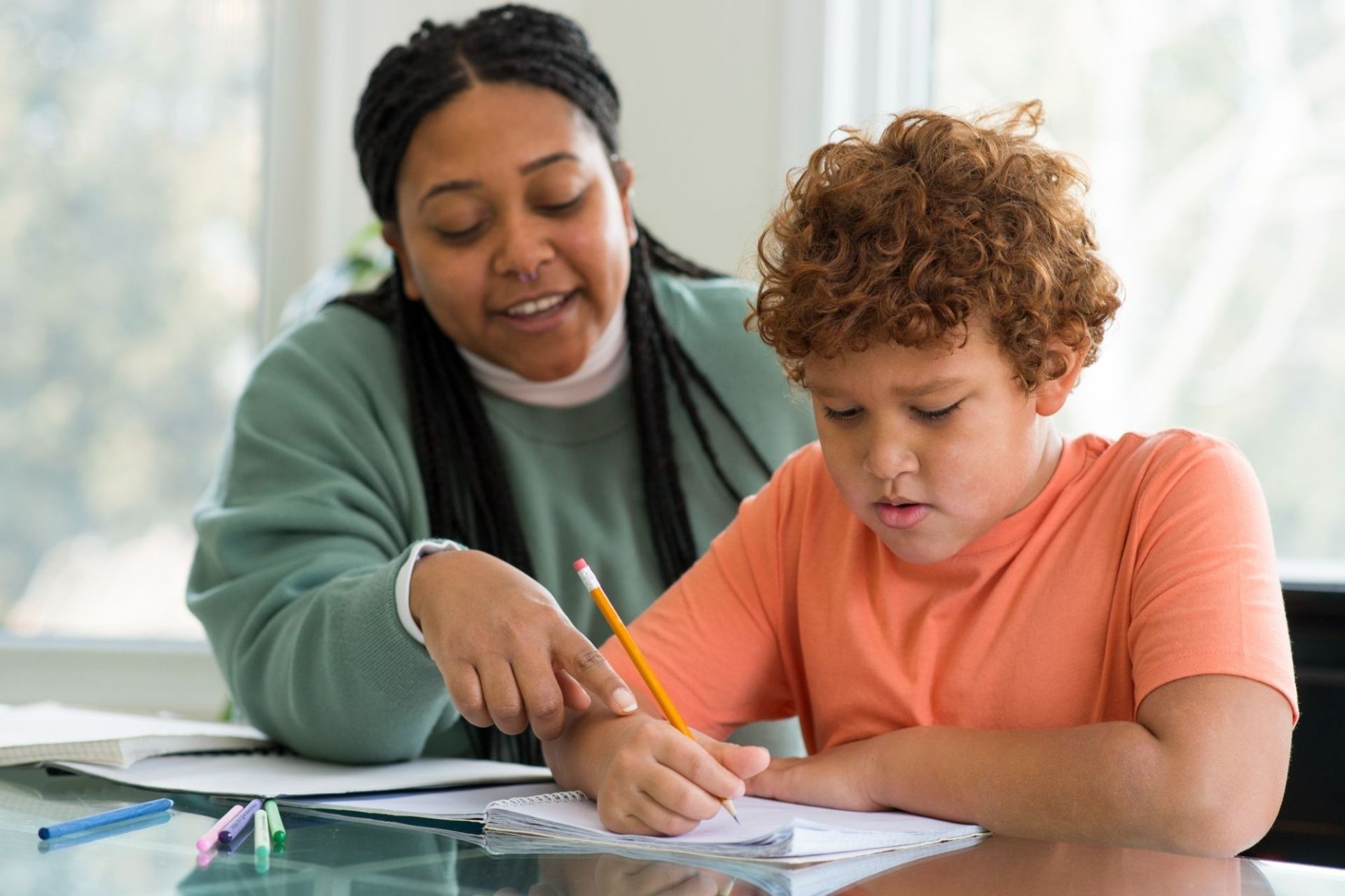 mother helping son with homework
