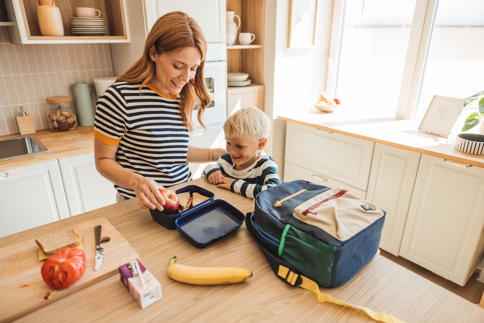Mom packing lunch avoiding back-to-school nutrition mistakes