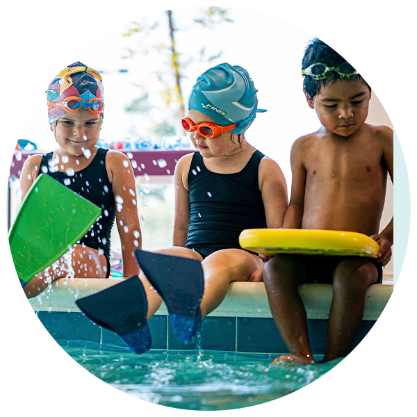 Elmer swim school (kids sitting at edge of pool)