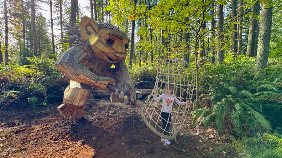 Lilnut, a Thomas Dambo troll capturing a visitor at Northwest Trek