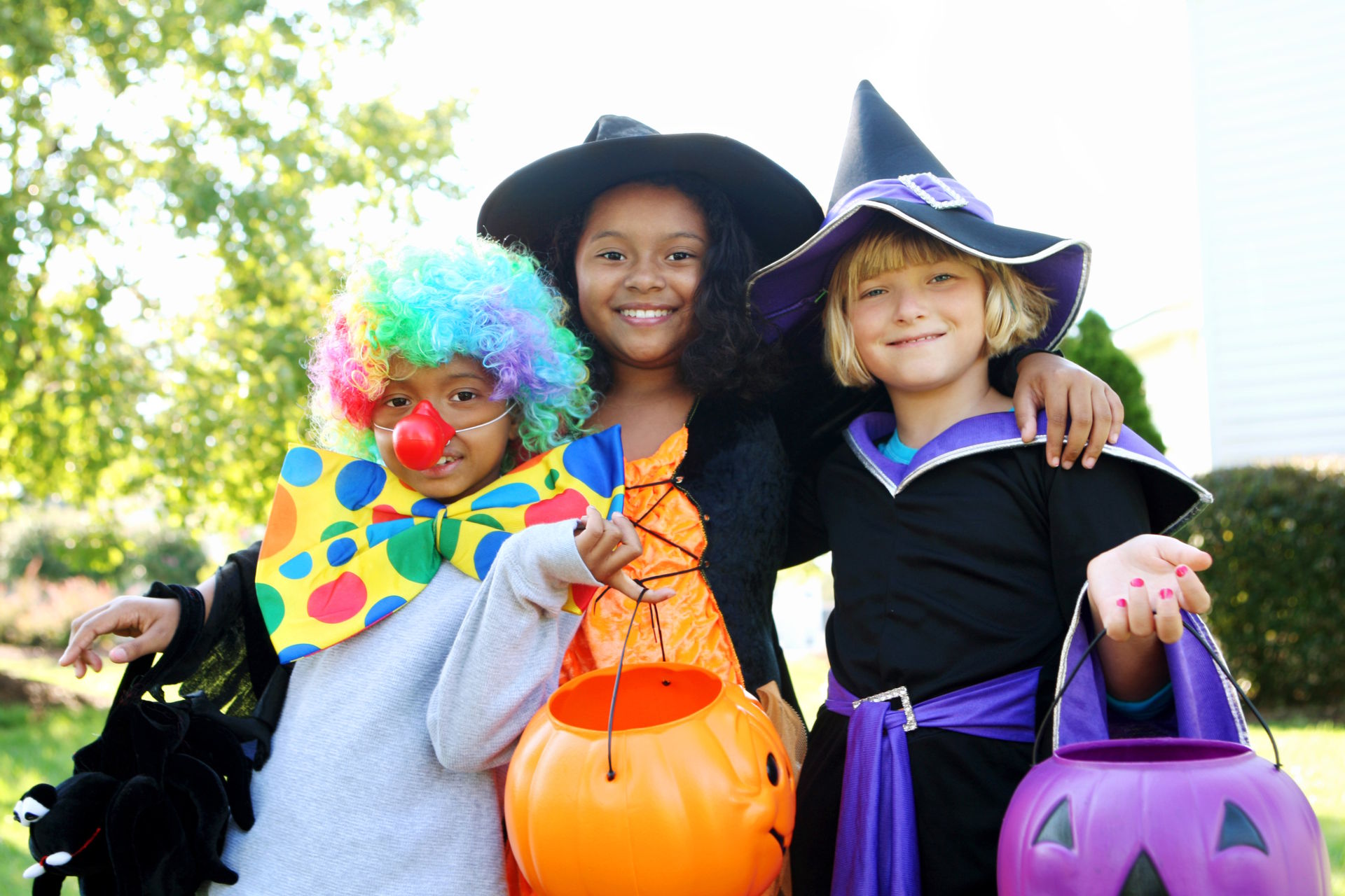 Kids wearing Halloween costumes heading out to get Halloween freebies