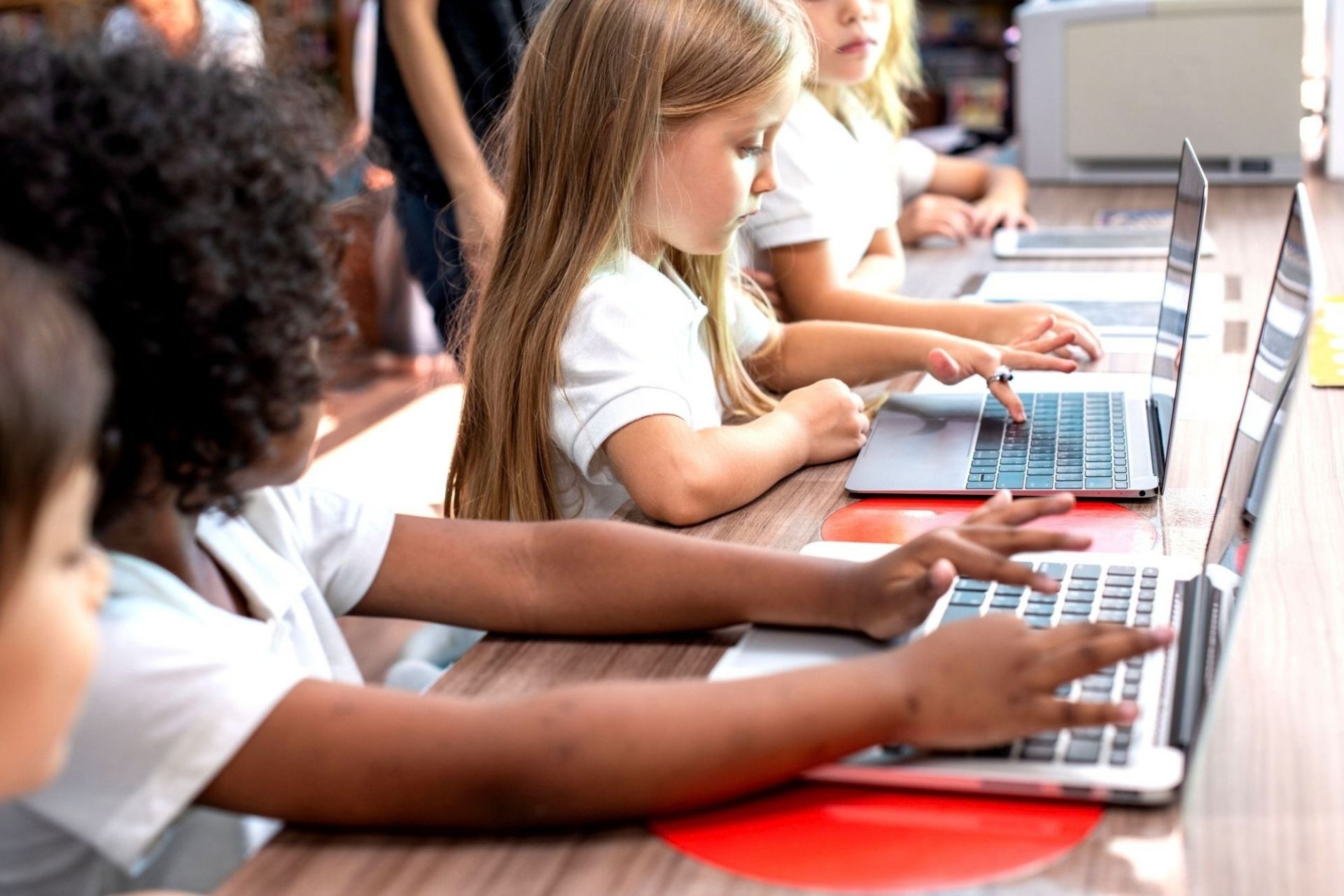 students using laptops at school