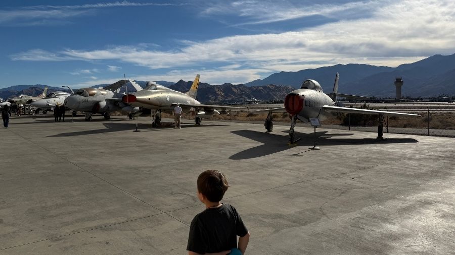 planes parked outside at the palm springs air museum