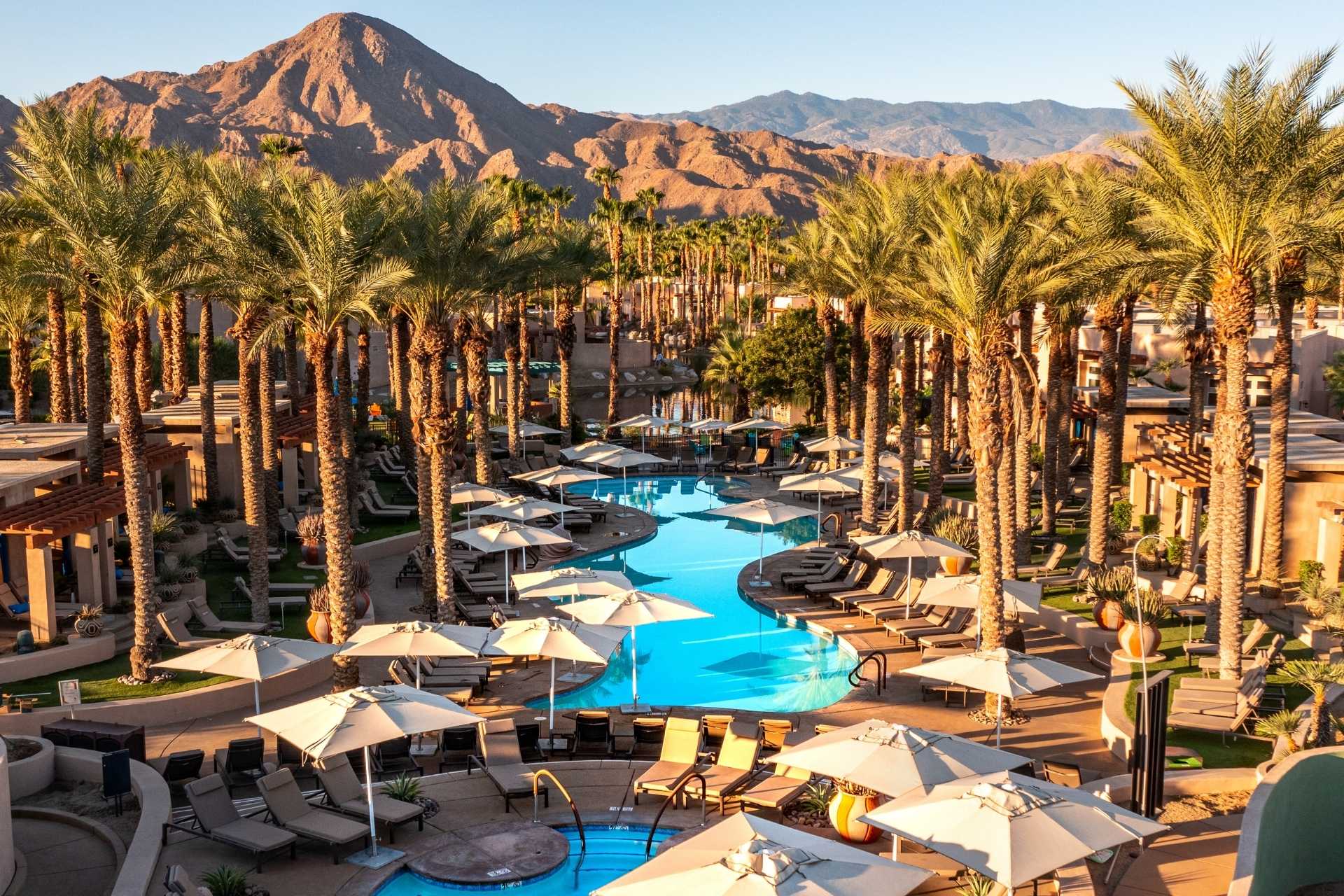 aerial view of the hytides adult pool at grand hyatt with mountains in background