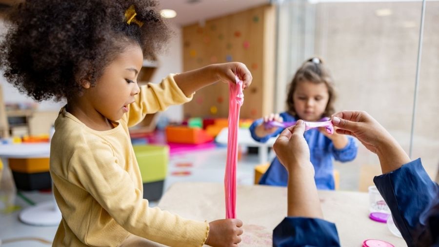 little girls playing with slime